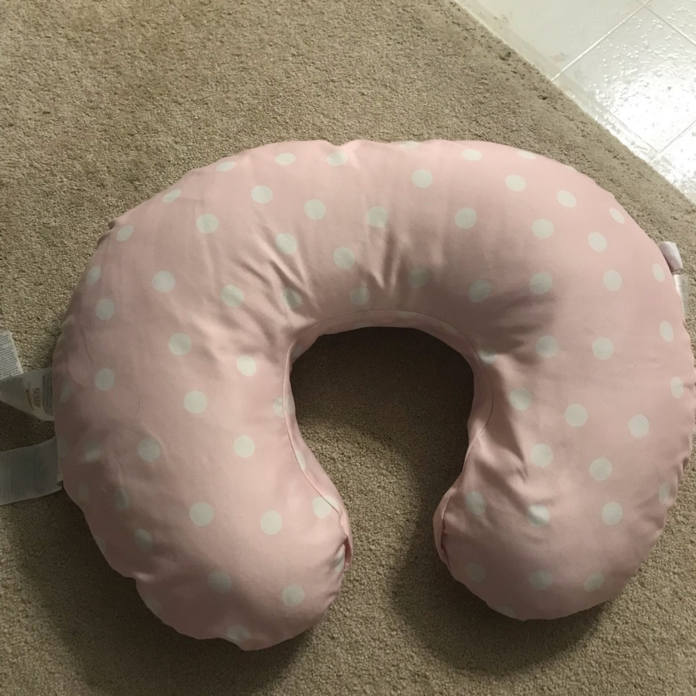 Girl Boppy Nursing Pillow baby, with a pink cover